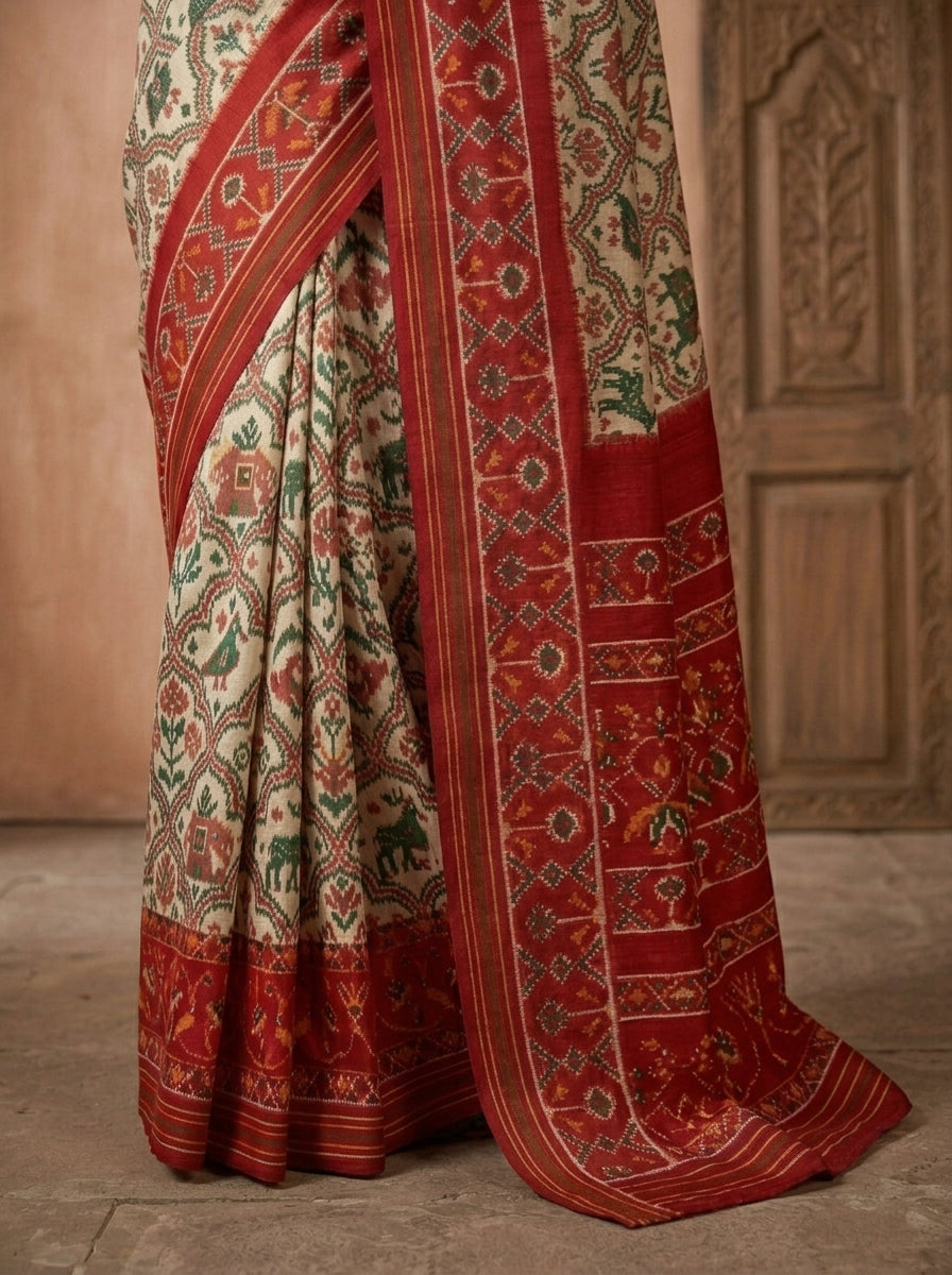 Navratna Ikat Patola Silk Saree in Ivory & Scarlet Red with Wildlife Narrative Weave